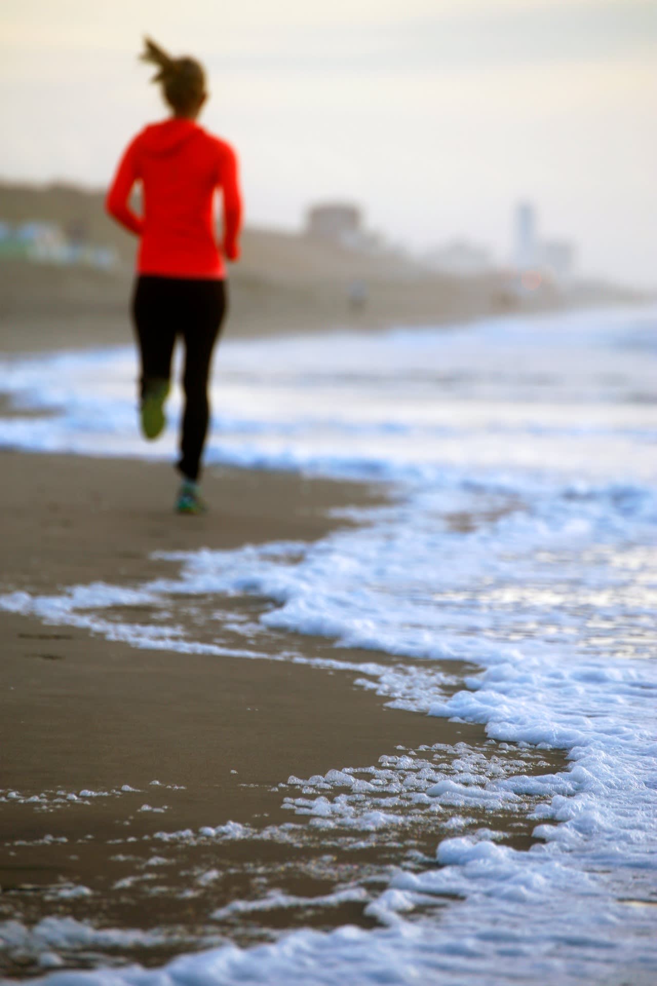 practice of mindful movement by running at the beach